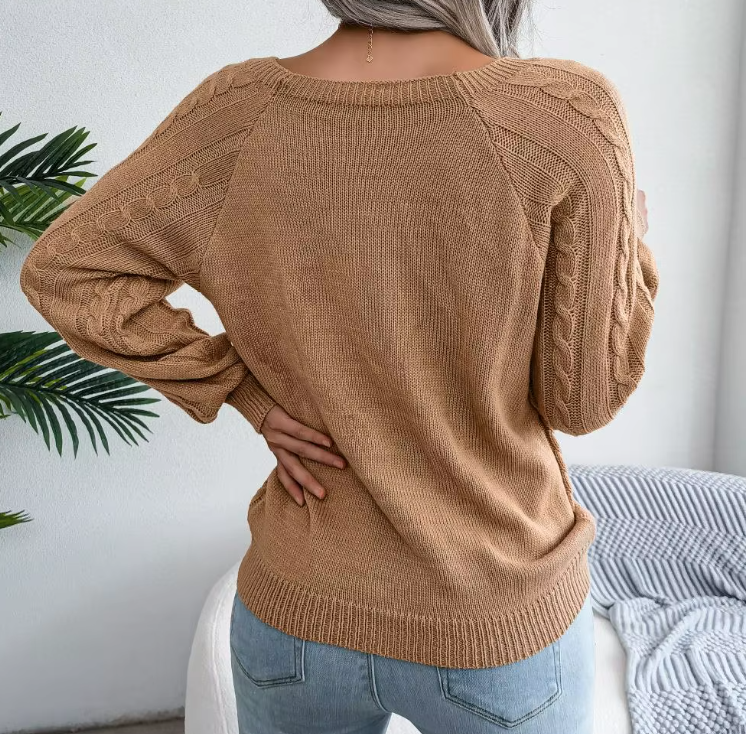 Maglione caldo lavorato a trecce