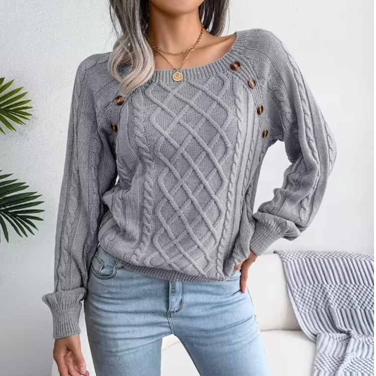 Maglione caldo lavorato a trecce