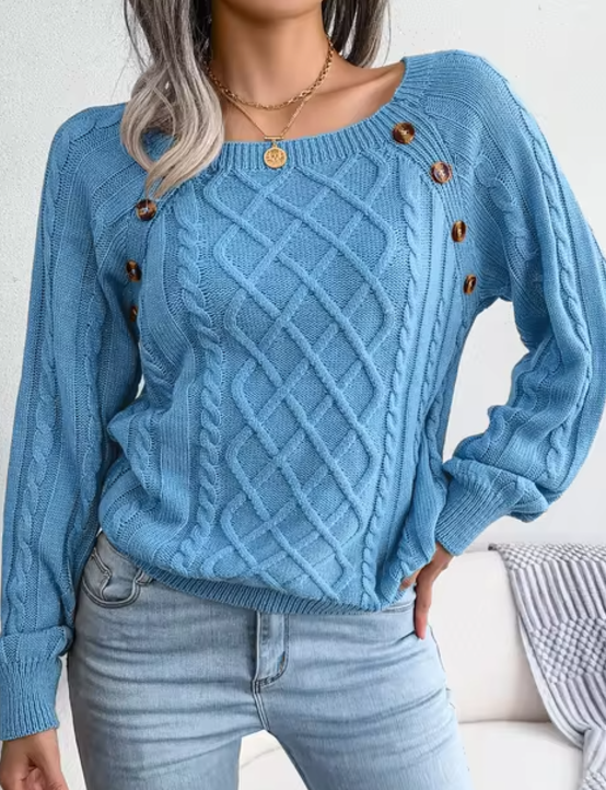Maglione caldo lavorato a trecce
